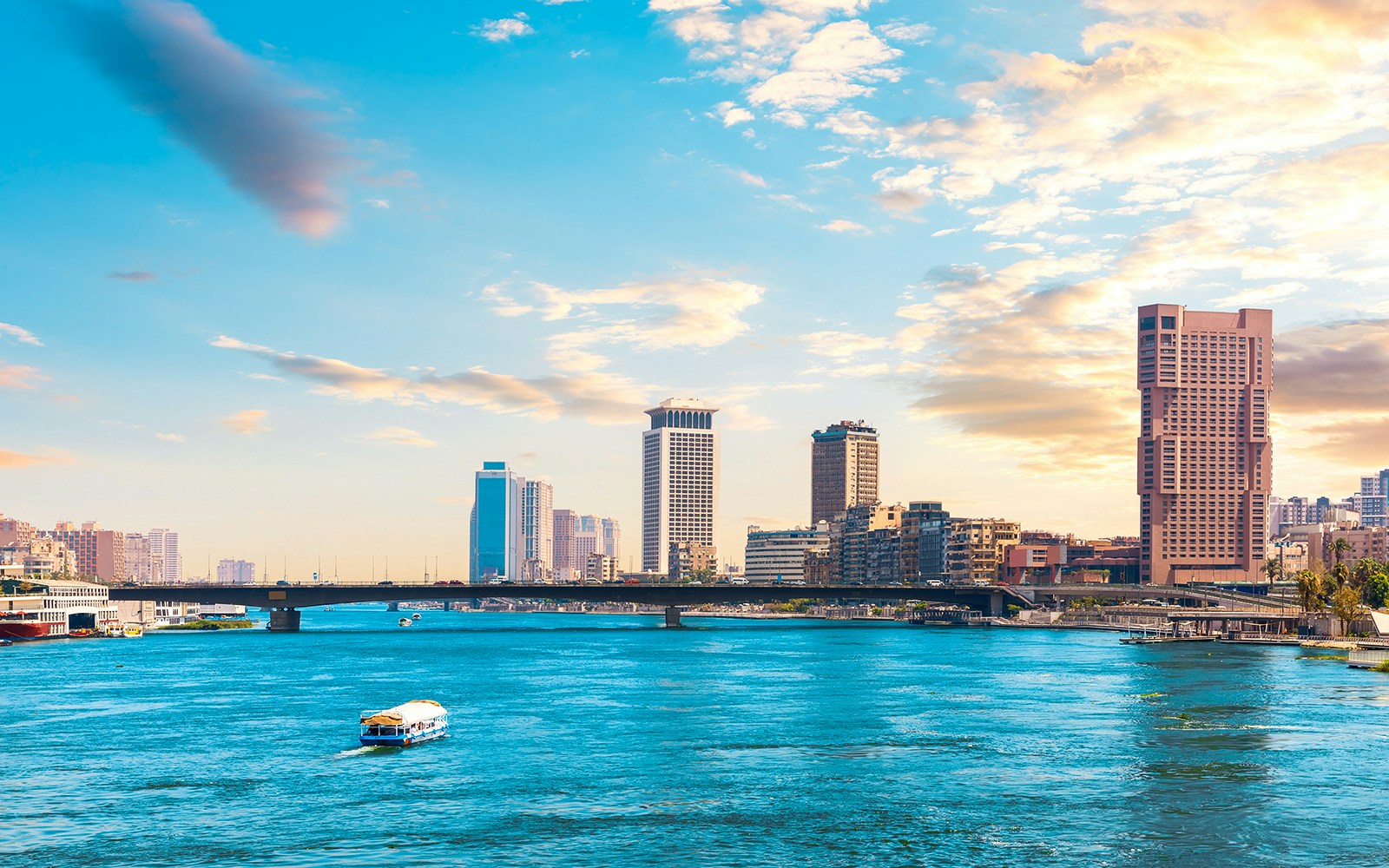 Nile River with bridge and skyscrapers in downtown Cairo, Egypt.