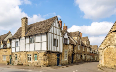 Historic stone cottages in Lacock village, Wiltshire, England.