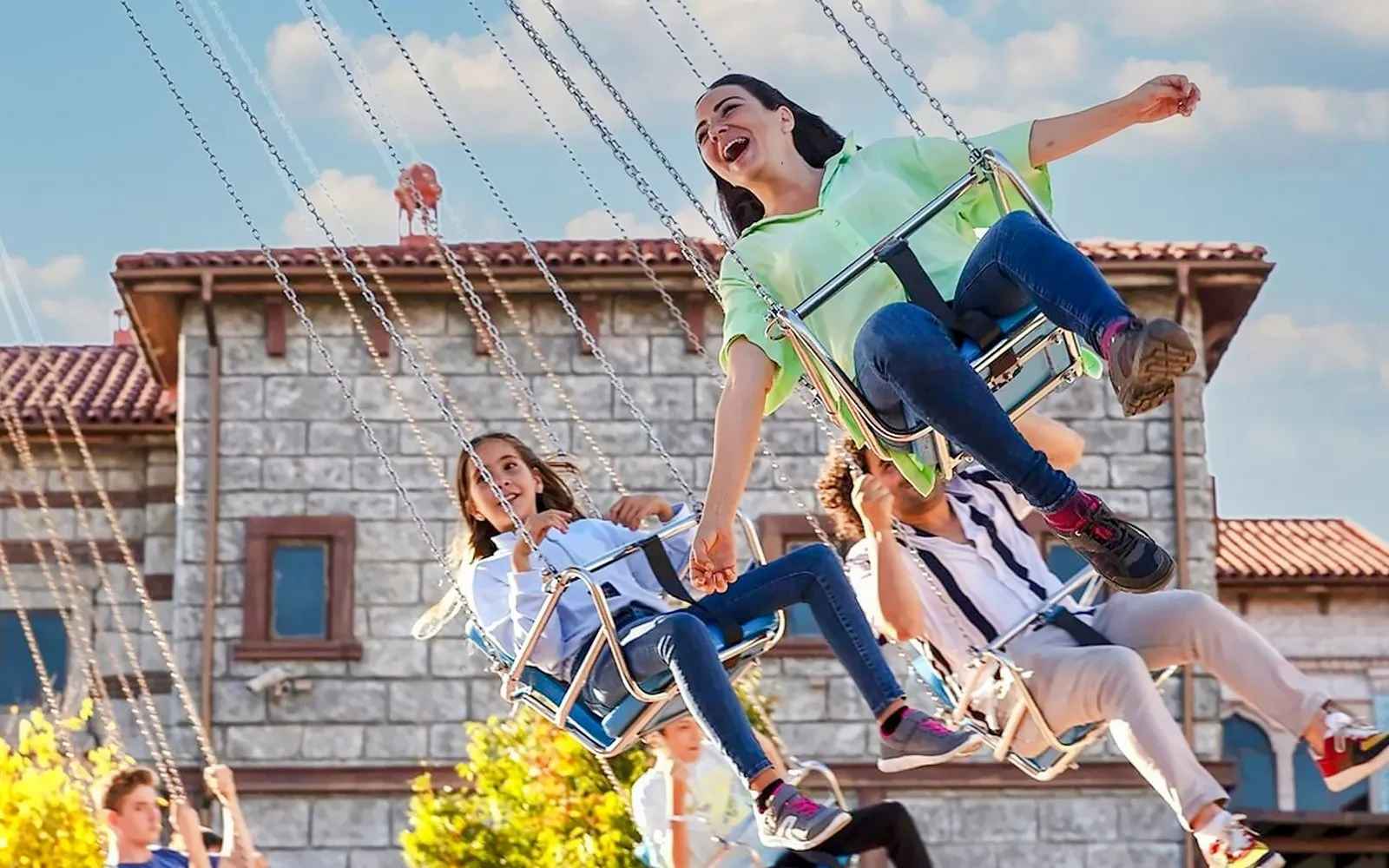 Visitors enjoying a swing ride at Vialand Theme Park, Istanbul.