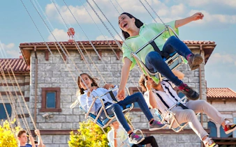 Visitors enjoying a swing ride at Vialand Theme Park, Istanbul.