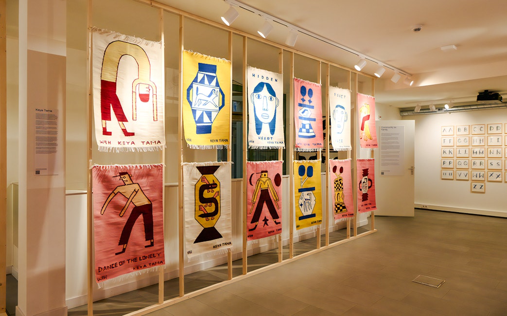 Textile art display at Straat Museum featuring colorful abstract designs.