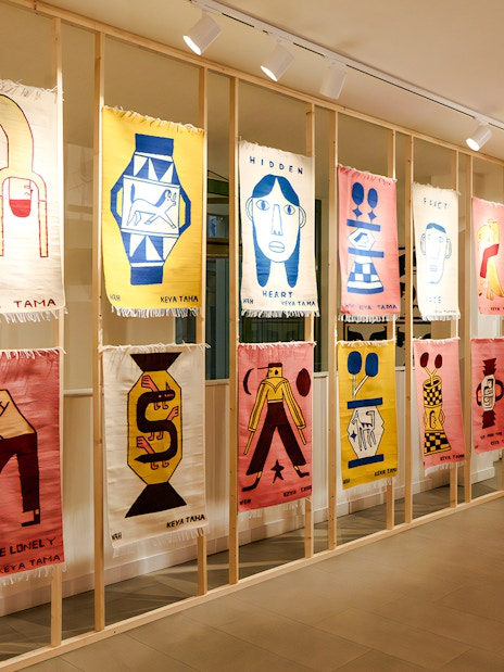 Textile art display at Straat Museum featuring colorful abstract designs.