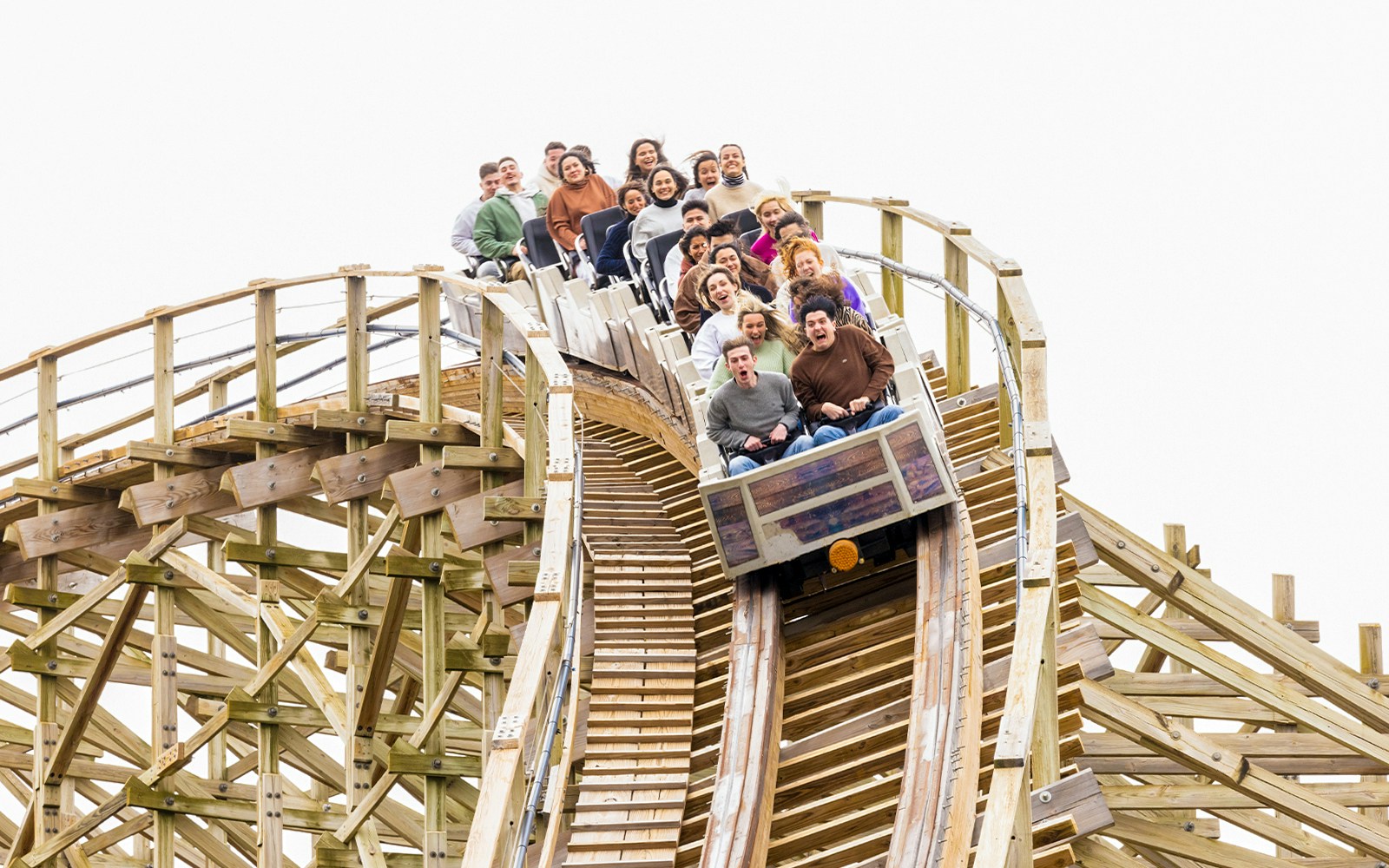 Coaster Express ride at Parque Warner Madrid with wooden tracks and thrilling curves.
