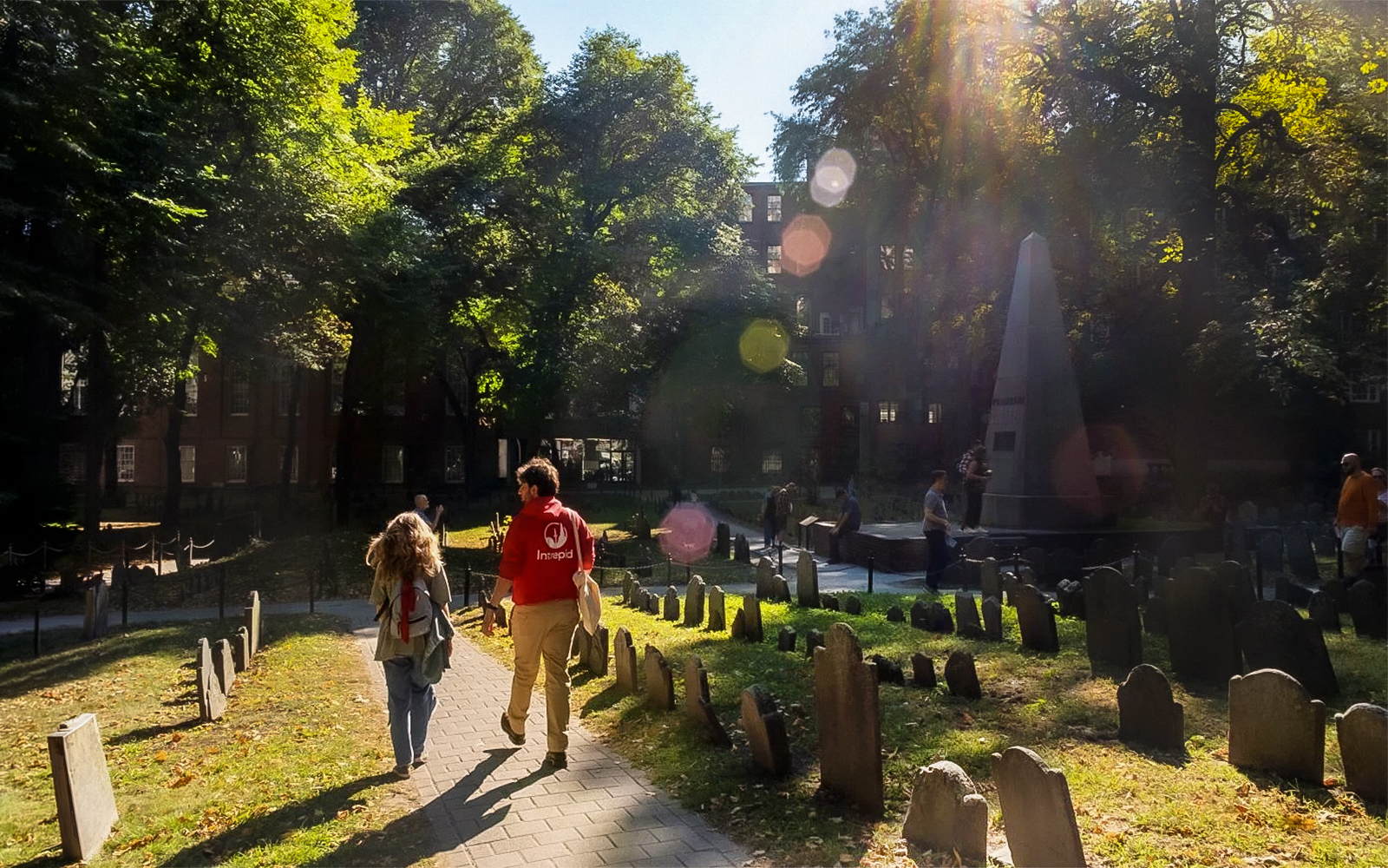 Tourists walking through historic cemetery on Boston History & Highlights Discovery Tour.