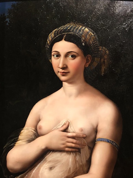 Raphael's "La Fornarina" portrait in ornate gold frame.