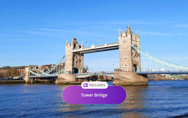 Tower Bridge spanning the River Thames in London under a clear blue sky.