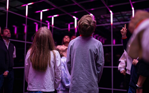 Visitors observing an exhibit at the Quake Earthquake Museum in Lisbon.