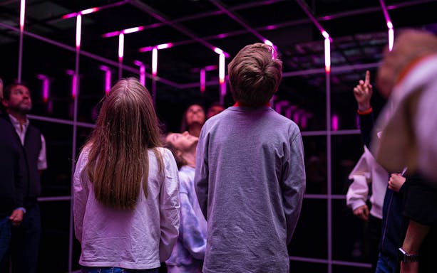 Visitors observing an exhibit at the Quake Earthquake Museum in Lisbon.