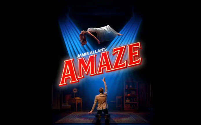 Magician performing levitation trick in Jamie Allan's Amaze show