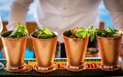 Signature cocktails with mint and lime on Dubrovnik sunset cruise.