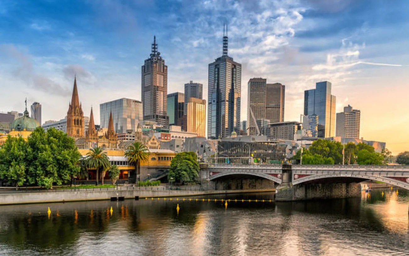Melbourne skyline with Yarra River and Princes Bridge during city tour.