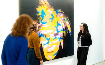 Visitors viewing colorful artwork at the National Gallery of Victoria during the Best of NGV Experiences Tour.