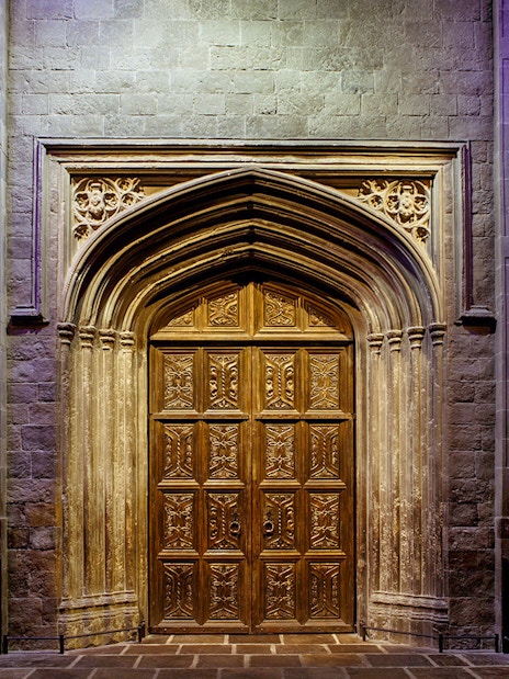 Entrance to the Great Hall at The Making of Harry Potter tour, featuring ornate wooden doors.