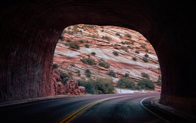 Tunnel view of red rock formations in Zion National Park, part of Vegas Bryce & Zion tour.