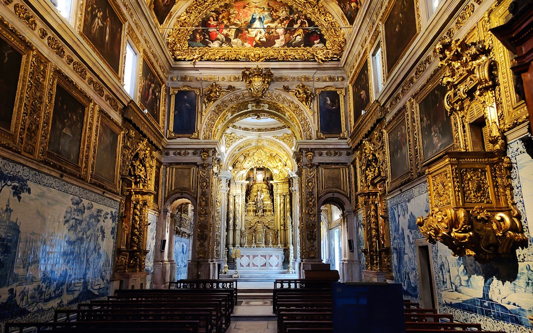Main altar of National Tile Museum in Lisbon, featuring ornate gold detailing and azulejo tiles.