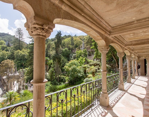 Quinta da Regaleira balcony with intricate stone carvings in Sintra, Portugal.