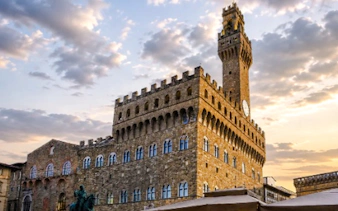 Palazzo Vecchio at sunset, Florence, featured in the Medici Power Story tour.