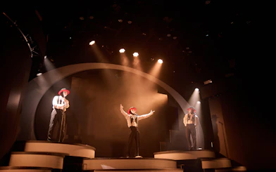 Performers in masks and hats on stage at Jabbawockeez show, Las Vegas.