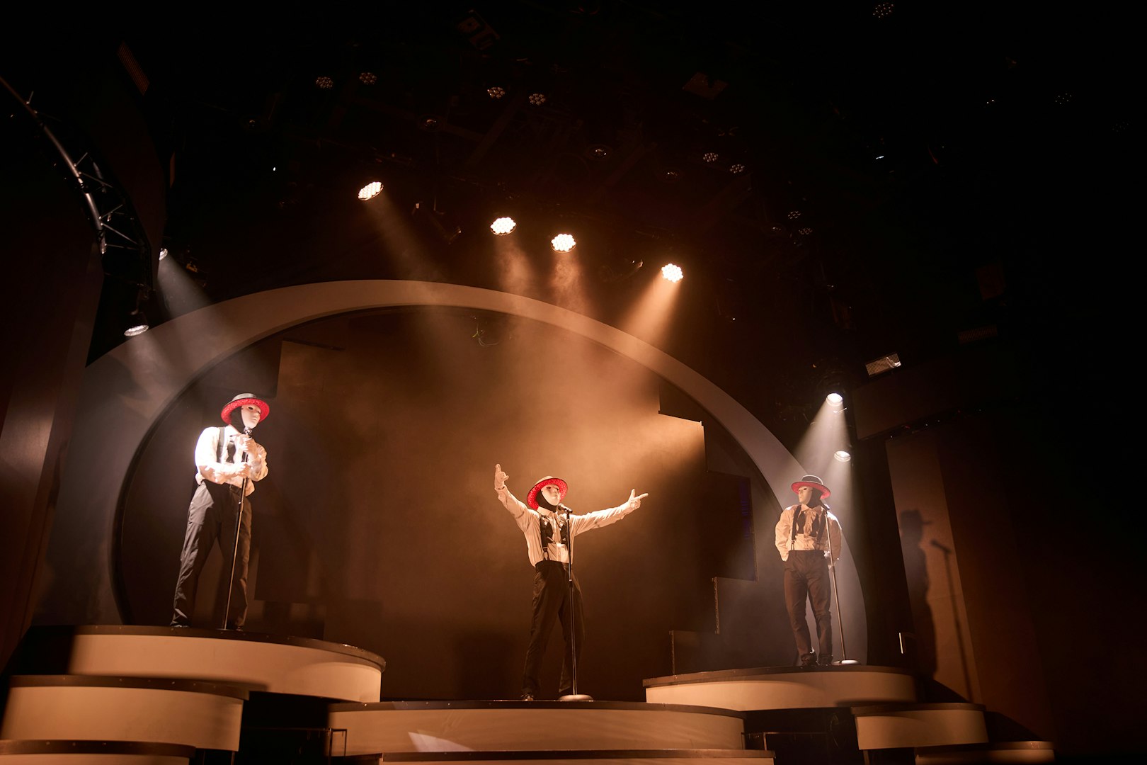 Performers in masks and hats on stage at Jabbawockeez show, Las Vegas.