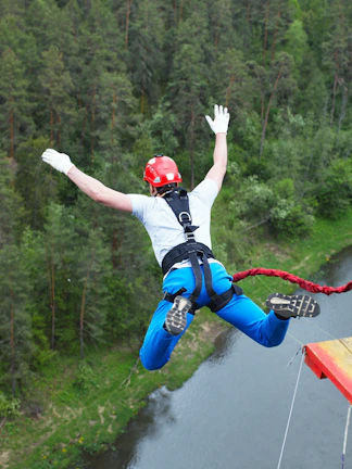 Bungee jumping experience near Blue Planet Aquarium, showcasing thrill-seekers mid-jump.