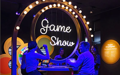 Interactive game show exhibit at the Money exhibition, The National Museum of Denmark.