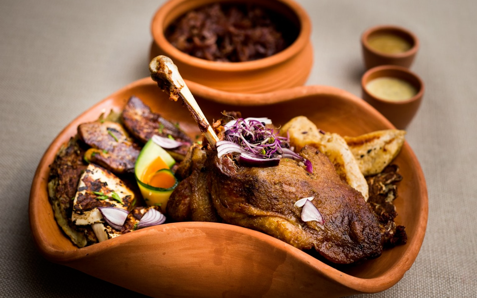 Lunch served during Full Day Visegrád Cruise with Medieval Show, featuring roasted meat and vegetables.