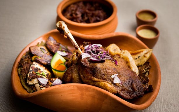 Lunch served during Full Day Visegrád Cruise with Medieval Show, featuring roasted meat and vegetables.