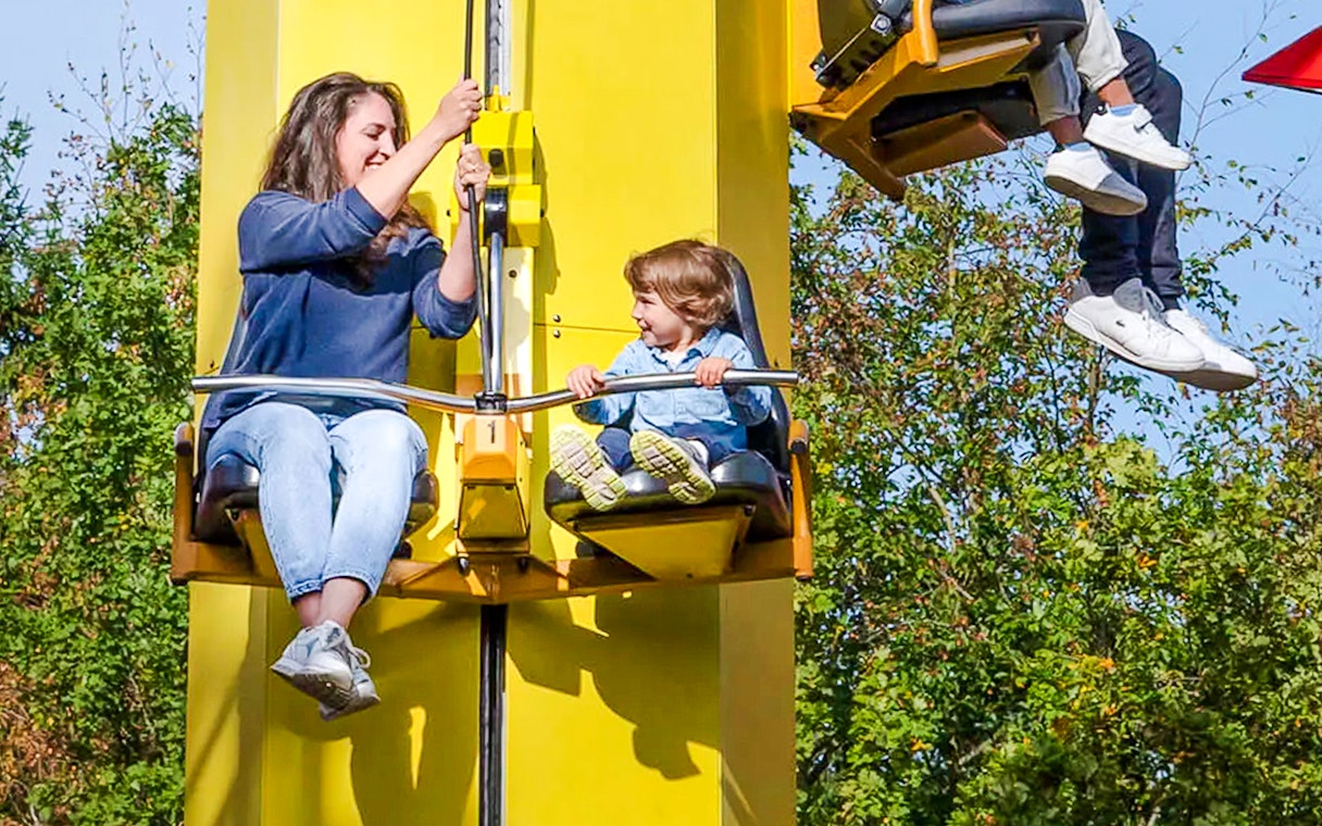 Guests on a ride at LEGOLAND Deutschland, enjoying the experience.