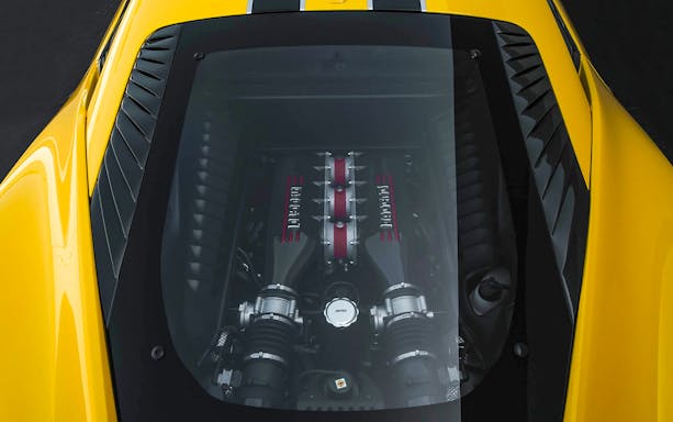 Ferrari engine view during guided tour with hotel transfers.