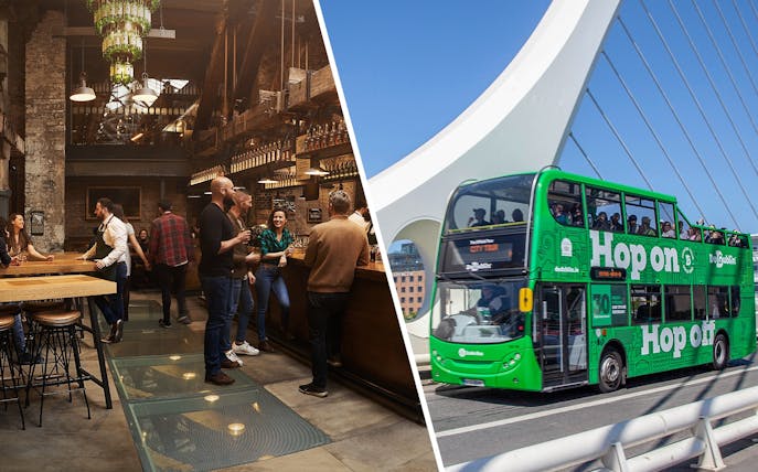 Visitors tasting whiskey at Jameson Distillery bar, Dublin; green tour bus on bridge.