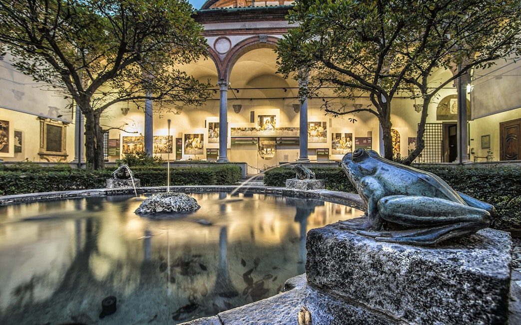 Courtyard with frog statues and fountain near Da Vinci's Last Supper in Milan.