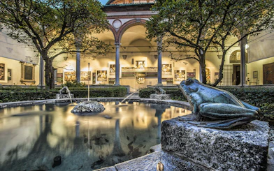 Courtyard with frog statues and fountain near Da Vinci's Last Supper in Milan.