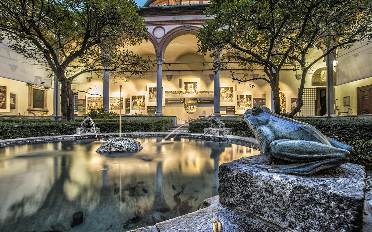 Courtyard with frog statues and fountain near Da Vinci's Last Supper in Milan.