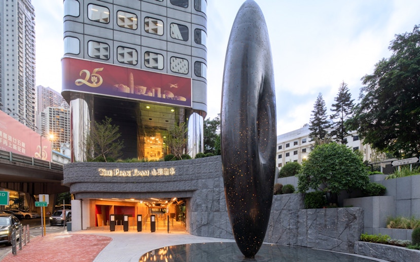 Entrance to The Peak Tram with modern sculpture in Hong Kong.