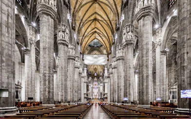 Duomo Cathedral Milan interior with ornate columns and detailed ceiling.
