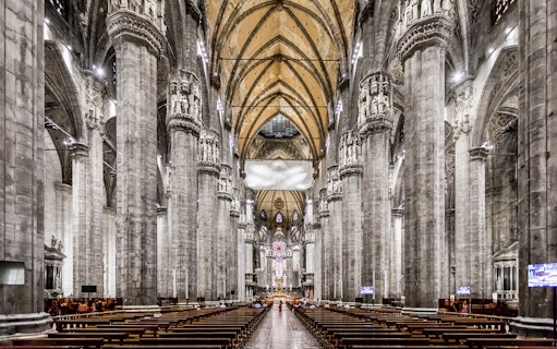 Duomo Cathedral Milan interior with ornate columns and detailed ceiling.