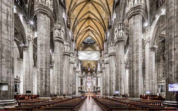 Duomo Cathedral Milan interior with ornate columns and detailed ceiling.