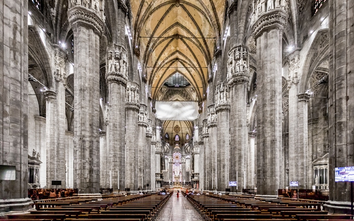 Duomo Cathedral Milan interior with ornate columns and detailed ceiling.