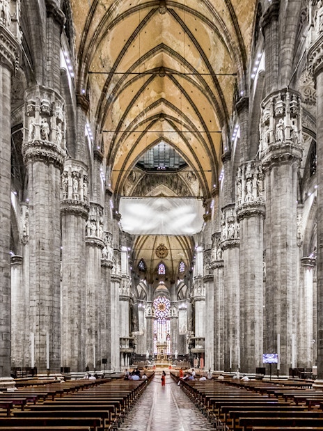Duomo Cathedral Milan interior with ornate columns and detailed ceiling.