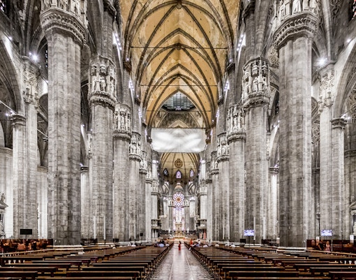 Duomo Cathedral Milan interior with ornate columns and detailed ceiling.