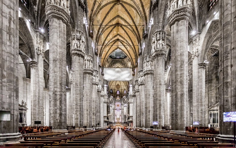Duomo Cathedral Milan interior with ornate columns and detailed ceiling.