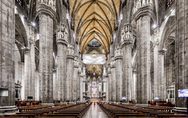 Duomo Cathedral Milan interior with ornate columns and detailed ceiling.
