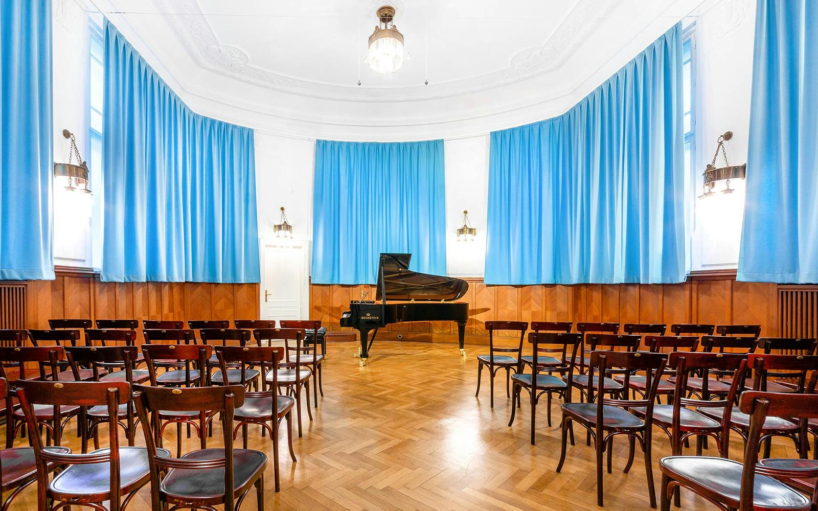 Concert hall with grand piano and seating at Ehrbarsaal, Vienna.