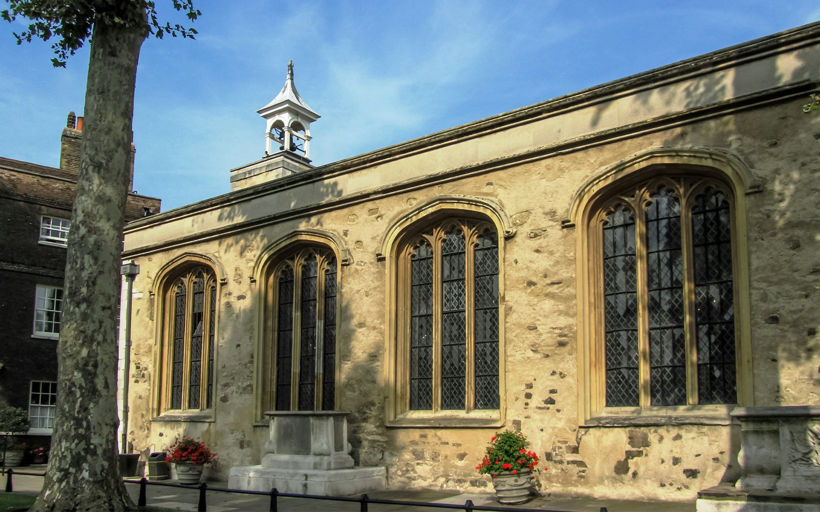 Chapel of St. Peter ad Vincula exterior with arched windows and bell tower.