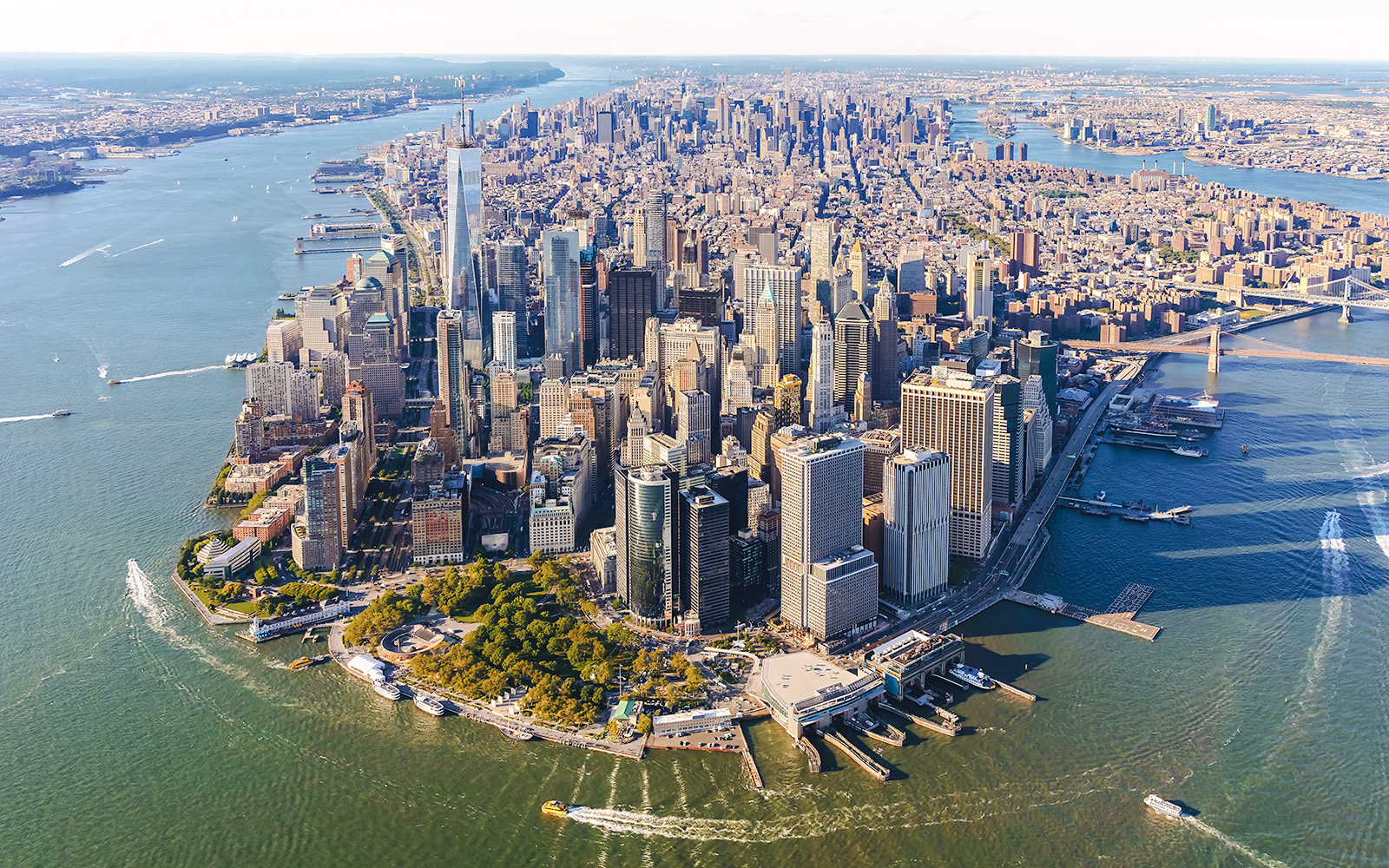 Aerial view of Lower Manhattan, New York City, featuring skyscrapers and waterfront.