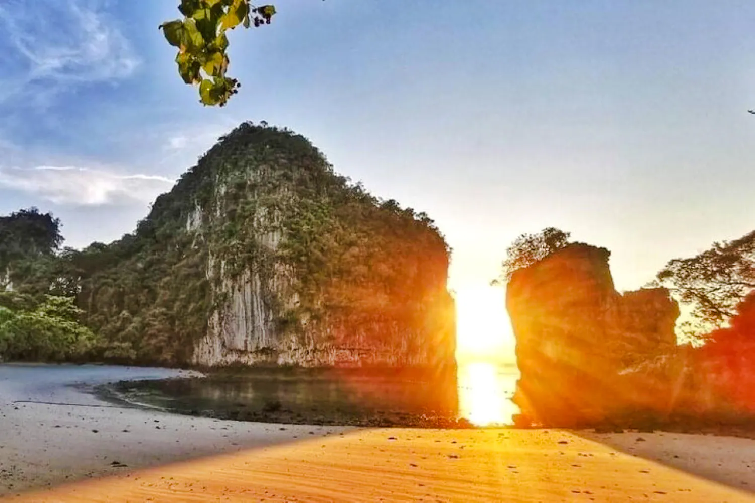 Sunset view of Hong Islands with limestone cliffs and sandy beach, Krabi.
