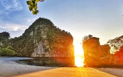 Sunset view of Hong Islands with limestone cliffs and sandy beach, Krabi.