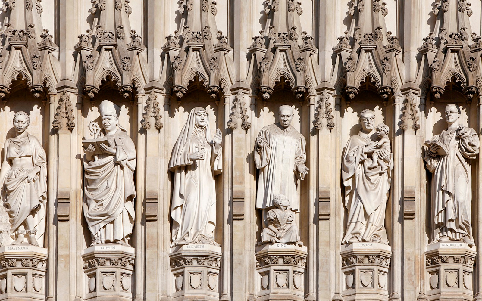 Statues of modern martyrs on Westminster Abbey facade, London.