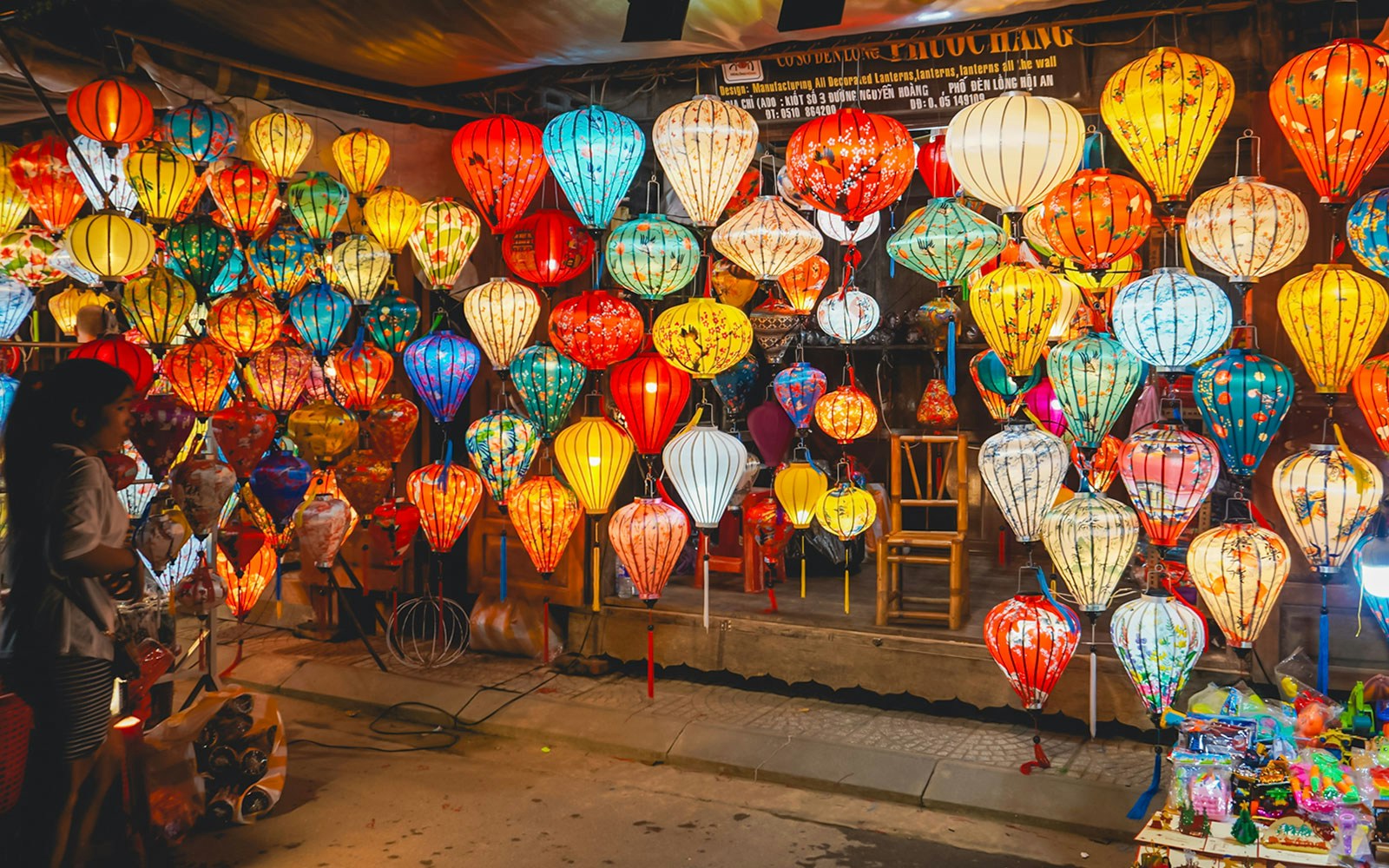 Hoi An night market with colorful traditional lanterns on display.
