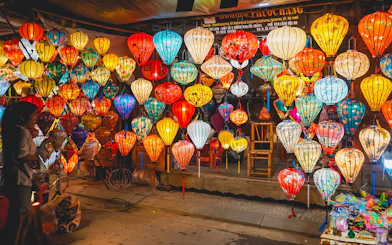 Hoi An night market with colorful traditional lanterns on display.
